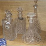Three cut glass decanters and two others
