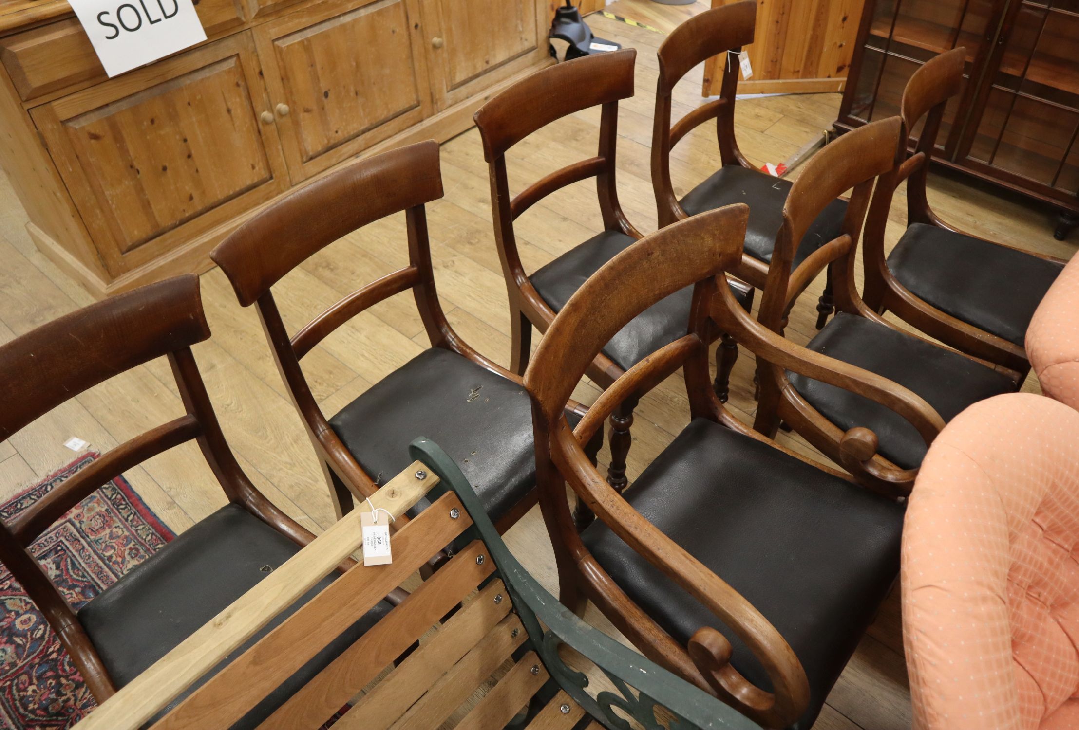 A set of seven William IV mahogany dining chairs (one having arms)