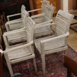 A set of six teak stacking garden chairs