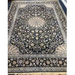 A Tabriz style blue ground carpet 388 x 279cm