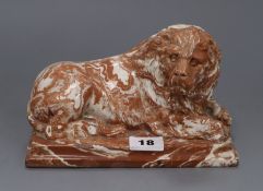 A 19th century agateware model of a recumbent lion length 19cm