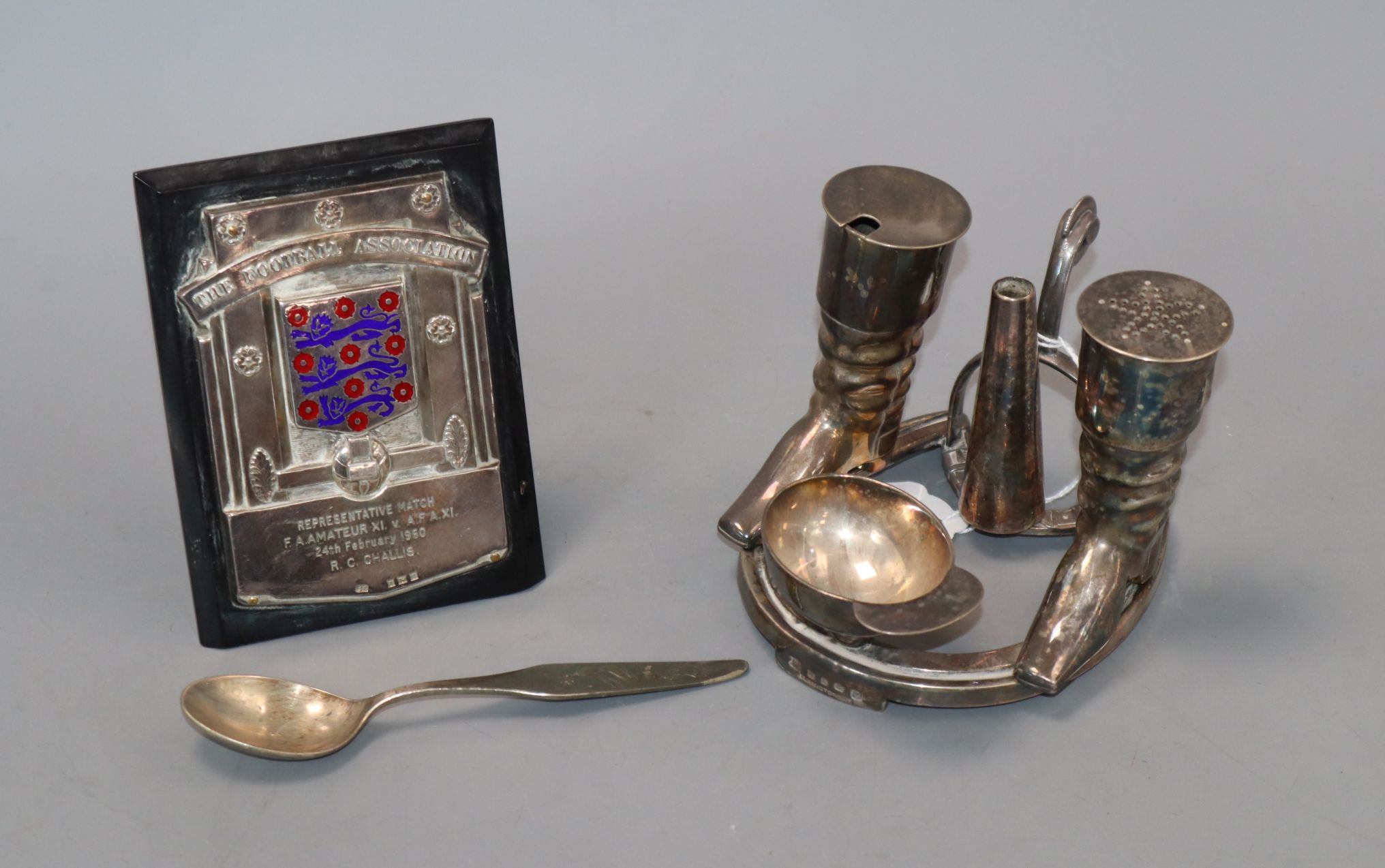 A silver football plaque, a WMF spoon and novelty plated hunting cruet