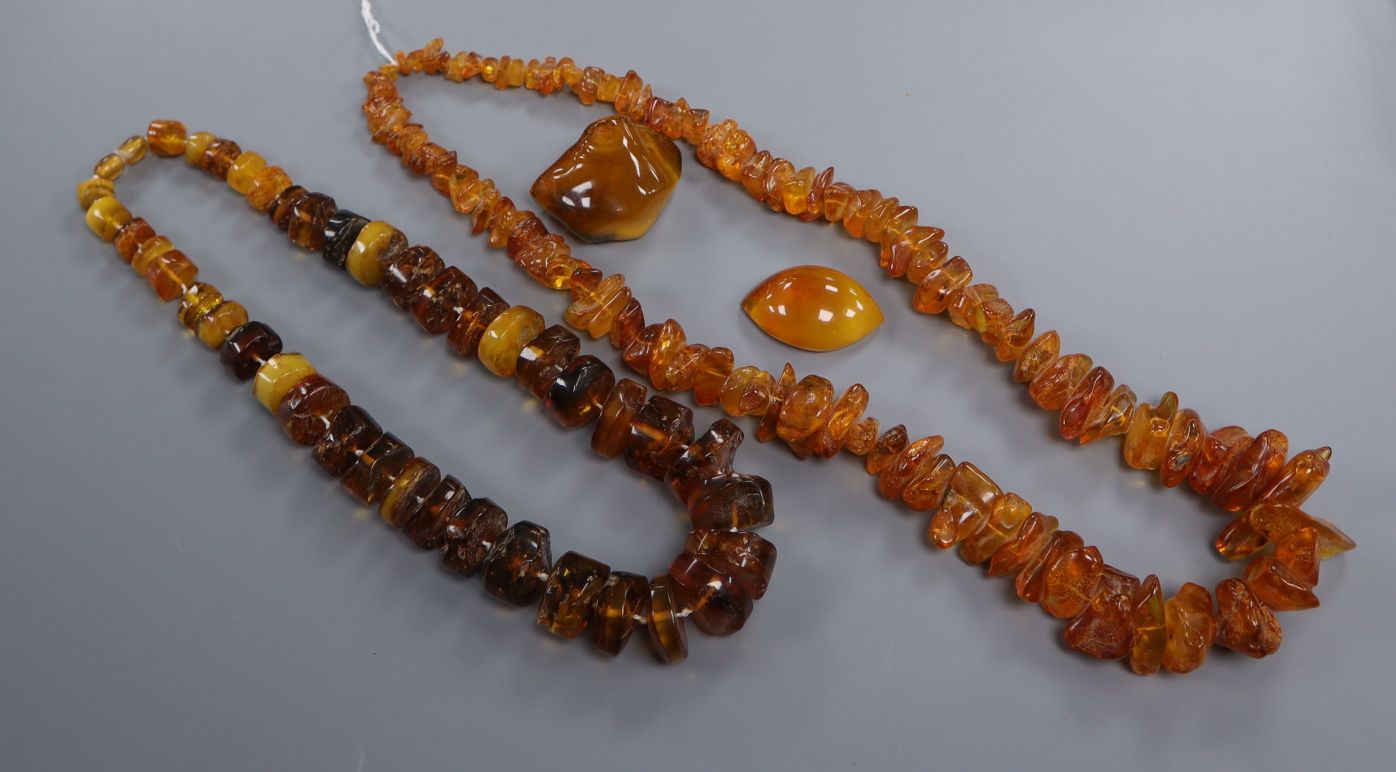 Two amber bead necklaces and a fragment