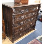 A 19th century Flemish style carved oak chest W.125cm