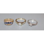An 18k gold sapphire and diamond three row dress ring, a small diamond cluster ring and another
