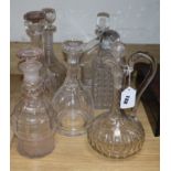 Six decanters and a ewer