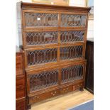 A four section Globe Wernicke style oak double bookcase W.129cm