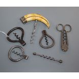 Six 19th century corkscrews, including a peg and worm, three steel folding bows, one with a hippo
