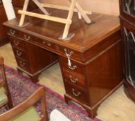 A 1920's mahogany pedestal desk W.137cm