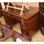 A 1920's mahogany pedestal desk W.137cm