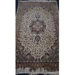A Kashan style ivory ground rug 218 x 136cm