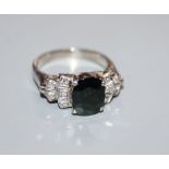 An 18k white gold diamond and sapphire dress ring, size O