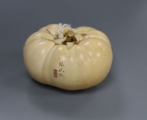 A good Japanese ivory model of a persimmon fruit, early 20th century, three character signature