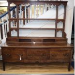 An 18th century oak dresser with open rack W187cm