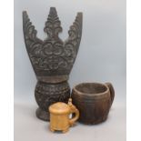 A Philippines carved wood storage vessel, a similar grain measure jug and a birch tankard (3)