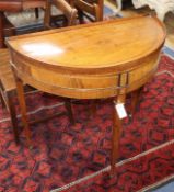 An early 19th century Dutch chequer inlaid mahogany 'D' shaped side table W.80cm