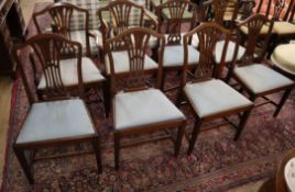 A set of eight George III style mahogany dining chairs