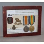 A set of English World War framed medals (pair) and badges