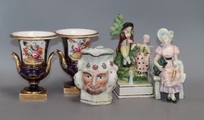 A small group of ceramics, including a pair of Derby style cobalt blue campana urns with floral