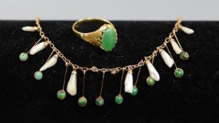 A Chinese yellow metal and jade ring, size L and a delicate gold mother of pearl and turquoise