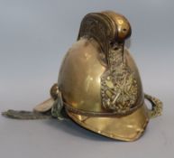 An early 20th century brass fireman's helmet
