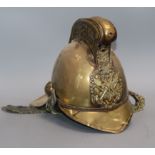 An early 20th century brass fireman's helmet
