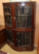 A 1920's mahogany bowfront display cabinet W.125cm