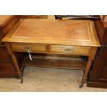 An Edwardian oak writing table W.92cm