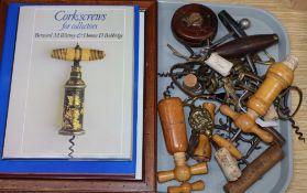 A collection of 19th/20th century corkscrews and two reference books, including finger pull, simple,