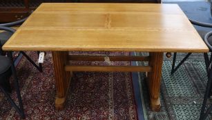 An Art Deco 1920's oak extending dining table L.137cm