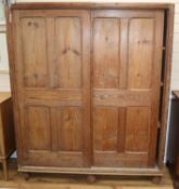 A Reformed Gothic pine two door cupboard W.149cm