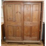 A Reformed Gothic pine two door cupboard W.149cm