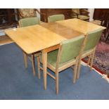 A Gordon Russell walnut dining suite table 152cm extended