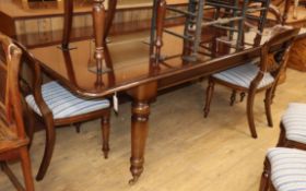 A Victorian style mahogany dining table L.238cm with leaf in