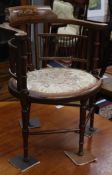 An Edwardian inlaid mahogany tub chair