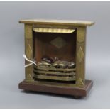 A World War I Trench art model of a fireplace with flint lighter