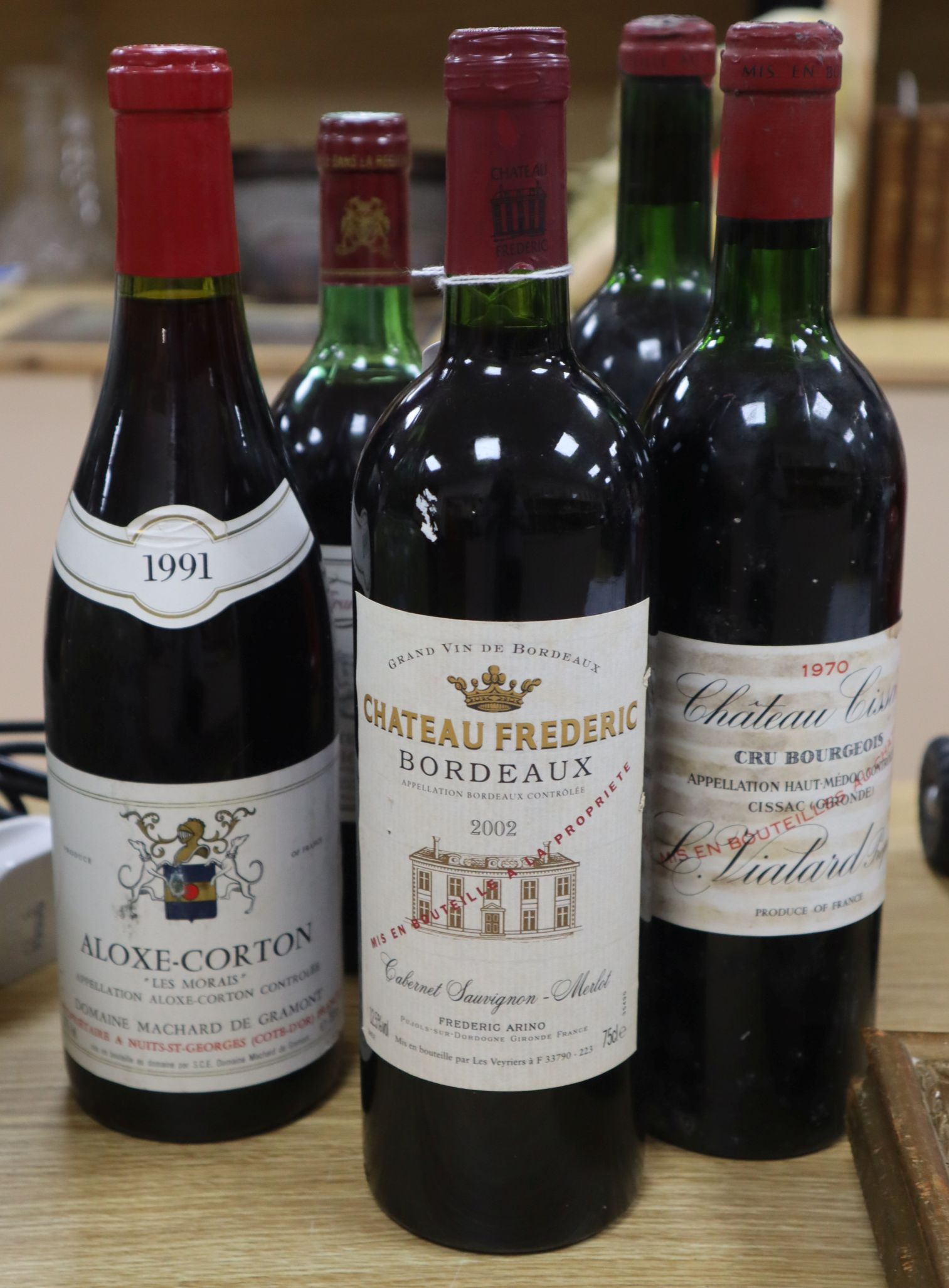 A bottle of Aloxe-Corton 'Le Morais' 1991, two bottles of Chateau Cissac Cru Bourgeois 1970 and