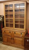 A Victorian oak bookcase cabinet W.137cm