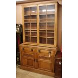 A Victorian oak bookcase cabinet W.137cm