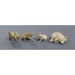 Four European ivory models of a sleeping piglet, a hare, an ox and a wild boar, early 20th century