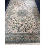 An Indian pale ivory ground carpet 315 x 197cm