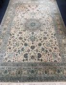 An Indian pale ivory ground carpet 315 x 197cm