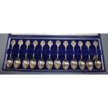A set of twelve David Cornell silver 'Zodiac' spoons, cased, retailed by John Pinches, in fitted