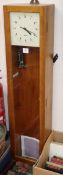 A Gents beech-cased electric Master clock (incomplete) H.129cm