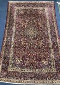 A silk Kashan red and blue rug 203 x 135cm