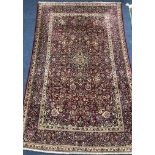 A silk Kashan red and blue rug 203 x 135cm