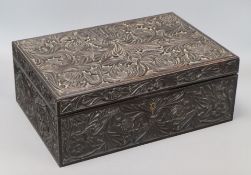 An Anglo-Ceylonese carved ebony box with ivory inlay, with specimen wood section lids to interior,