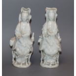 A pair of Chinese porcelain figures of Guanyin, 19th century height 14cm