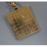 A 9ct gold 1927 calendar/identity pendant set with a single diamond on 9ct gold suspension chain,
