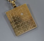 A 9ct gold 1927 calendar/identity pendant set with a single diamond on 9ct gold suspension chain,